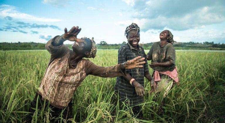 Female farmers laughing in the rice